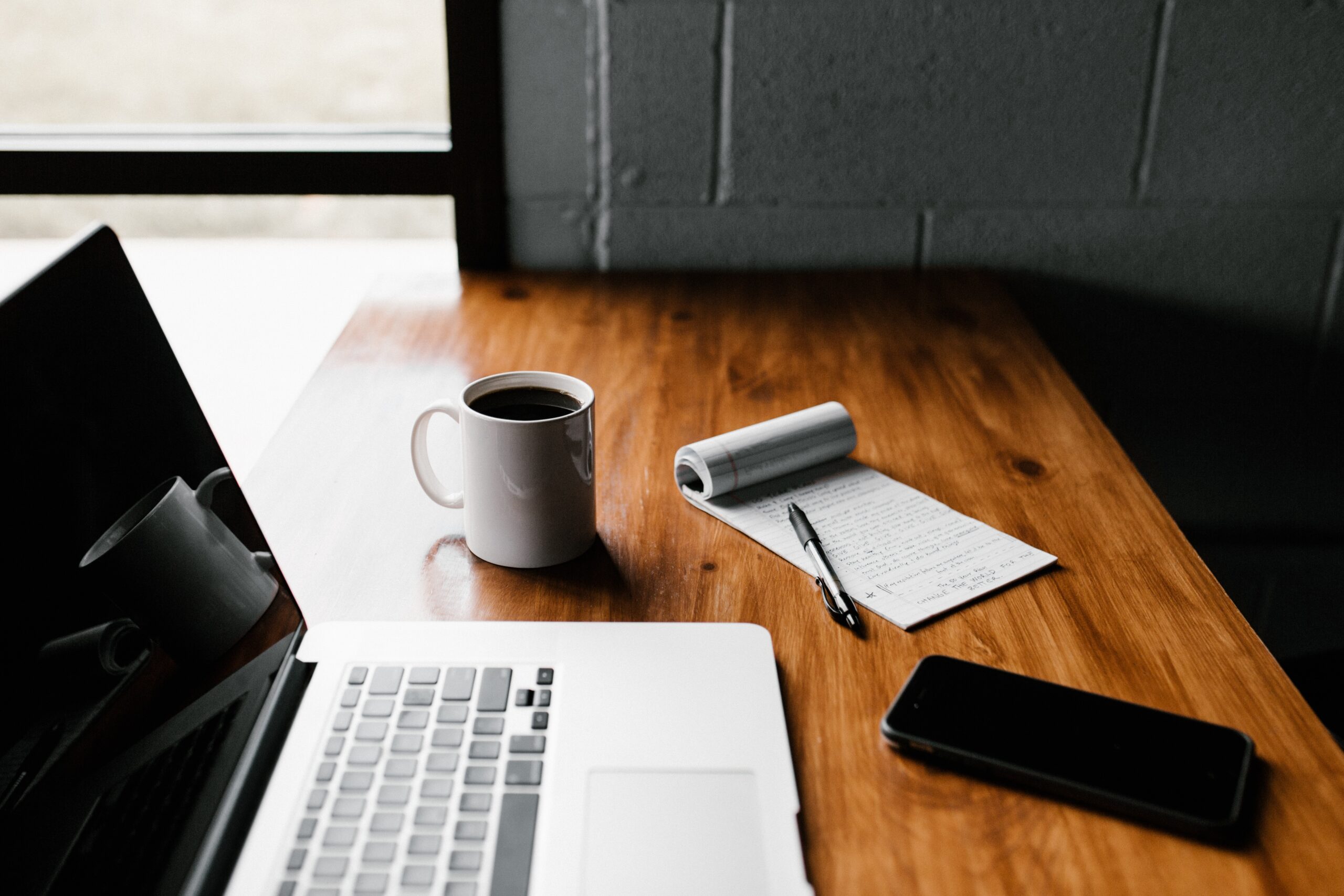 Handy-Checklist-for-Handling-Technology-Safely-During-a-Home-or-Office-Move-scaledjpg • Elementor Hosted Website MacBook Pro, white ceramic mug,and black smartphone on table